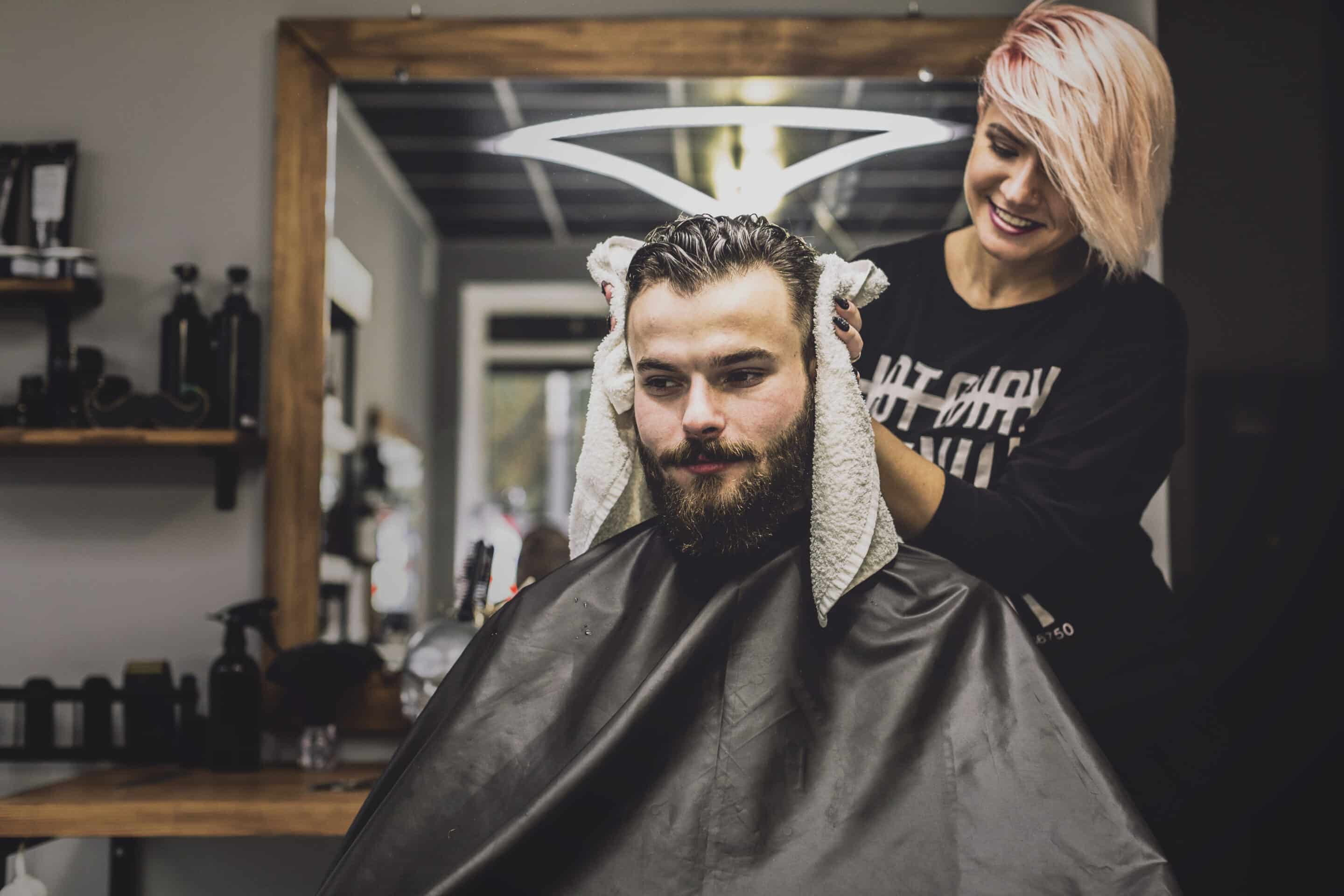 woman-wiping-head-customer-salon